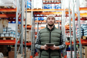 a man in a construction supplies store holding a tablet