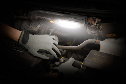ENR_HCP_Work_Light_Lifestyle Image_C_HCAL41_GLOBAL a man checking the car engine with the Energizer HardCase Professional Work Area Light