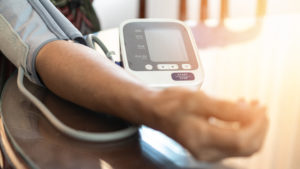 a person getting the heart rate and blood pressure checked